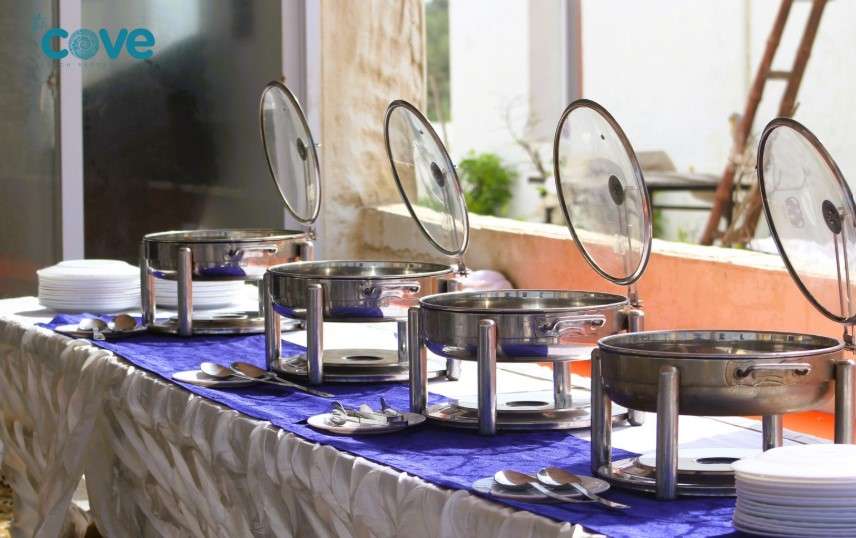Corporate dinner at The Cove Resort & Restaurant featuring gourmet food, beachside views, and engaging activities